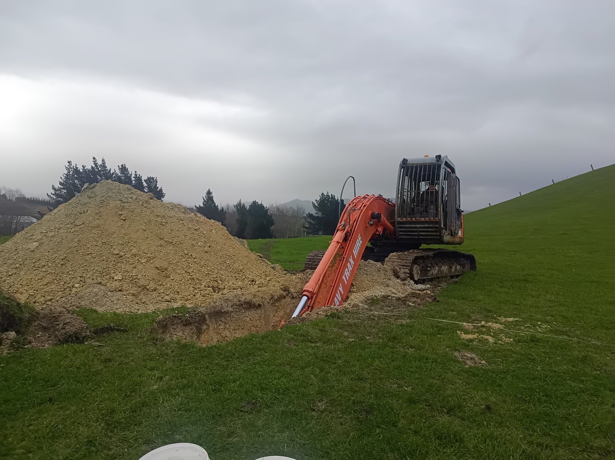 Excavator completing test work on pastoral land